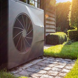 Air heat pump near pool house outdoors.